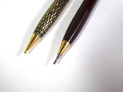 Lot 166 - A Sheaffer fountain pen with nib stamped 14K in a lattice work case and with matching pencil, a...