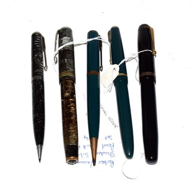 Lot 184 - A Parker Vacumatic fountain pen with nib stamped 14K and matching pencil, a Parker fountain pen...