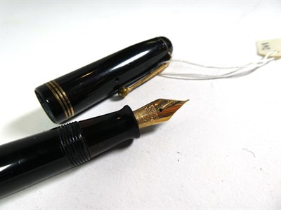 Lot 184 - A Parker Vacumatic fountain pen with nib stamped 14K and matching pencil, a Parker fountain pen...