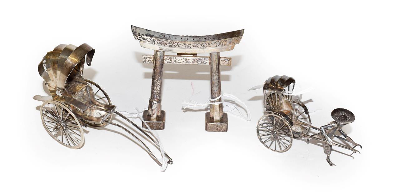 Lot 215 - A Japanese pepperette, in the form of a Japanese Torii gate and two Chinese silver models of...