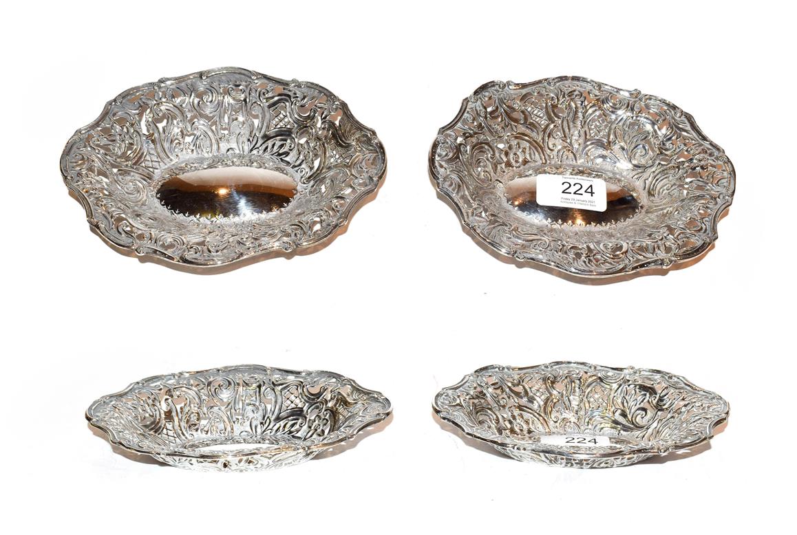 Lot 224 - A pair of Victorian silver dishes, by Deakin and Francis, Birmingham, 1892, each shaped oval,...