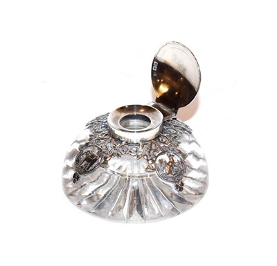 Lot 234 - An Edward VII silver-mounted glass-inkwell, by Samuel Jacob, London, 1902, the glass body...