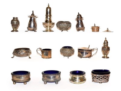 Lot 244 - A collection of assorted silver condiment Items, including: a pair of pepperettes, chased with...