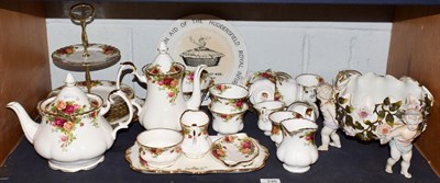 Lot 248 - A Royal Albert tea and coffee service decorated in the Old Country Roses pattern (approximately...