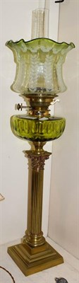 Lot 250 - A Victorian brass based oil lamp, raised on a fluted Corinthian column base, with Messenger's...