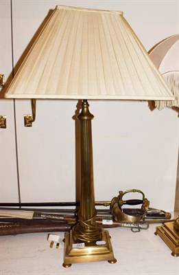 Lot 251 - A pair of brass table lamps of fluted column form, raised on square stepped bases over button feet