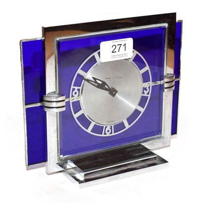 Lot 271 - An Art Deco Garrard Le Coultre chrome and glass mantle clock, the circular dial with Arabic...