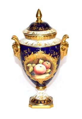 Lot 273 - A Coalport twin handled urn and cover hand painted with apples and blackberries, signed M....