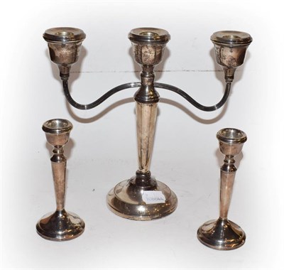 Lot 296 - An Elizabeth II weighted silver three light candelabra by A T Cannon Ltd, Birmingham 1973, together