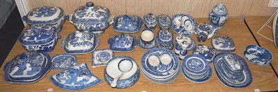 Lot 303 - A quantity of 19th century Old Willow pattern blue and white tureens and covers, plates and ladles