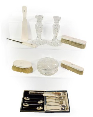 Lot 334 - 19th century ivory dressing table items bearing a crest, a powder jar, a pair of glass candlesticks