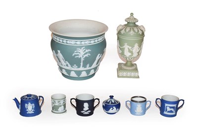 Lot 348 - A group of Wedgwood Jasper ware including a vase, urn and cover, twin handled cups etc