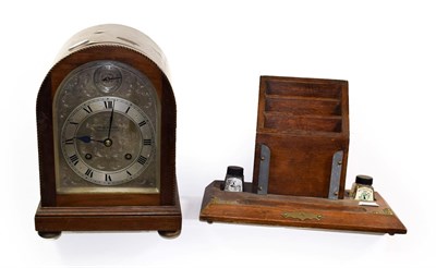 Lot 370 - A Reid & Sons checkered string inlaid mahogany veneered striking mantel clock, the silvered...