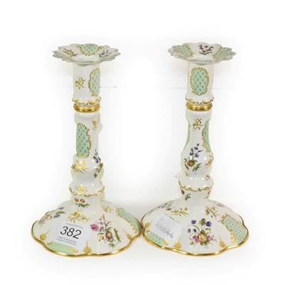 Lot 382 - A pair of Halcyon Days Bilston style enamel candlesticks, 16cm high