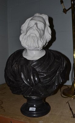 Lot 394 - A two-tone marble head and shoulders bust of a bearded gentleman on socle base, 67cm high