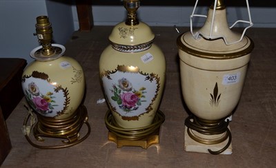 Lot 403 - A painted plaster urn formed table lamp and two porcelain examples (3)