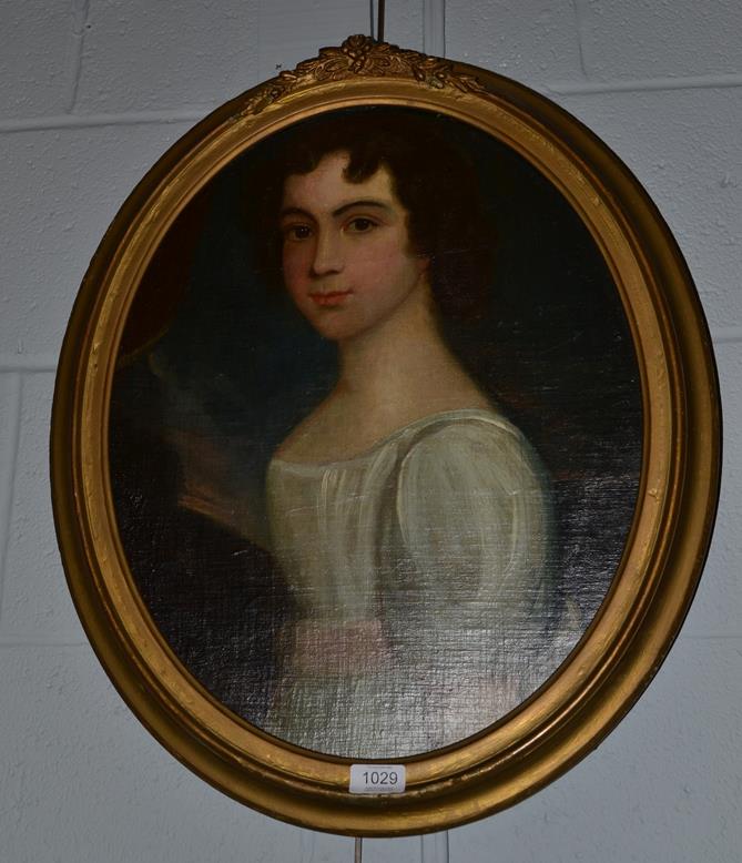 Lot 1029 - British school 19th century Portrait of a young lady, half length wearing a white dress with...