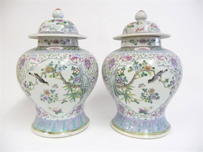 Lot 153 - A Pair of Chinese Porcelain Baluster Jars and Cover, late 19th/early 20th century, painted in...