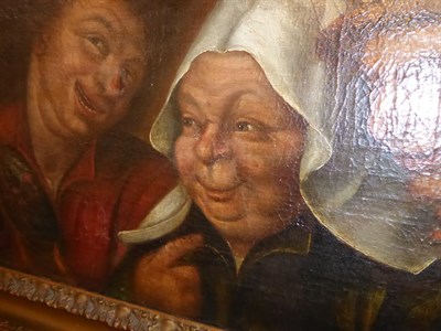 Lot 1038 - Manner of Adriaen van Ostade, Figures merrymaking, oil on canvas, 32cm by 50cm