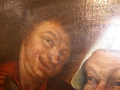 Lot 1038 - Manner of Adriaen van Ostade, Figures merrymaking, oil on canvas, 32cm by 50cm