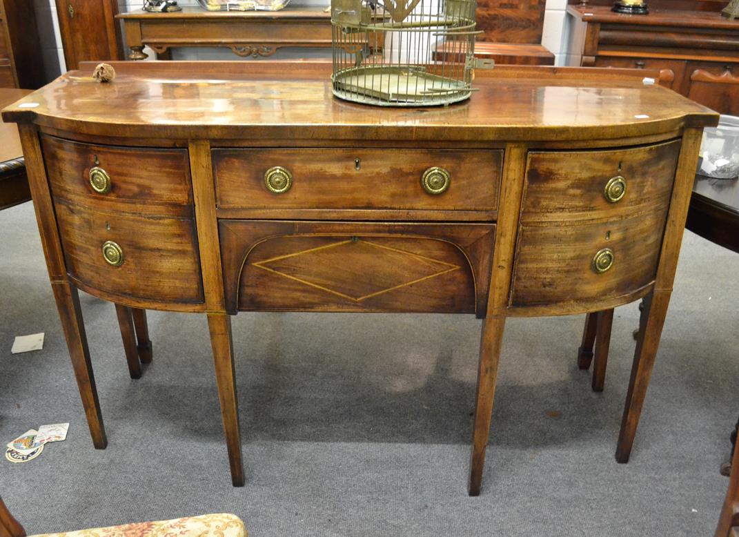 Lot 1101 - A George III crossbanded and inlaid bow fronted sideboard, 152cm by 56cm by 95cm high