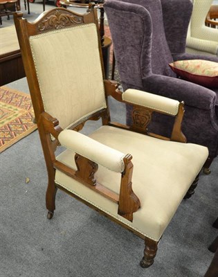 Lot 1105 - A Victorian carved mahogany upholstered fireside armchair