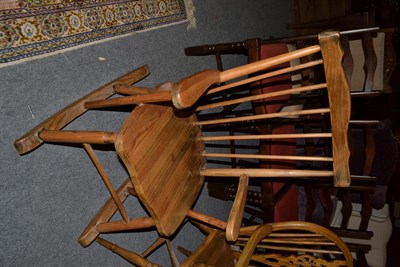 Lot 1108 - A pine spindle back rocking chair