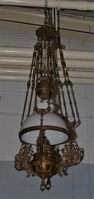 Lot 1116 - A 19th century brass and wrought iron hanging oil lamp, along with a similar rise and fall...