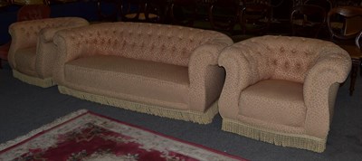 Lot 1117 - An early 20th century Chesterfield three-piece suite upholstered in buttoned fabric, comprising...