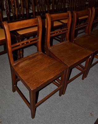 Lot 1121 - A set of five George III oak dining chairs
