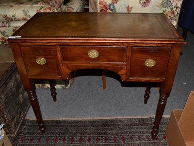 Lot 1137 - An early 20th century leather inset mahogany writing table 94cm by 49cm by 84cm high