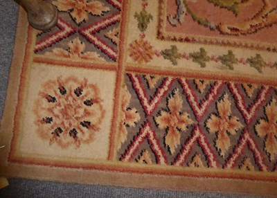 Lot 1139 - A small carpet, machine made of Savonnerie design, the soft corn field centred by a floral roundel