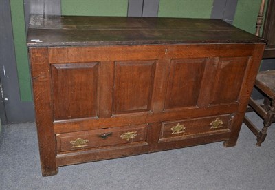 Lot 1143 - A joined oak chest with hinged lid