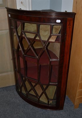 Lot 1152 - A George III mahogany bow-fronted handing corner cupboard, 67cm by 42cm by 104cm high