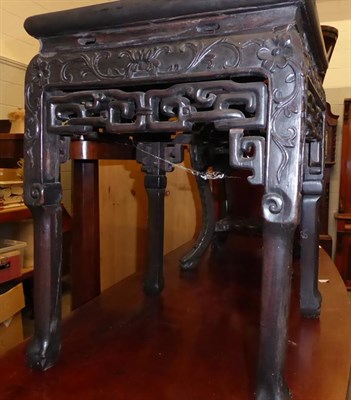 Lot 1163 - A Chinese pierced and carved hardwood square marble top plant stand, 35cm square by 47cm