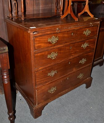 Lot 1171 - A George III mahogany bachelors chest of drawers, with four long graduated drawers and a...