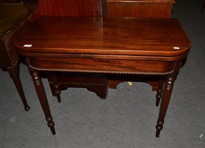Lot 1173 - A 19th century mahogany fold over tea table, 91cm by 45cm by 75cm high