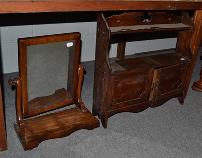 Lot 1186 - Two Victorian mahogany toilet mirrors, a coal scuttle and a hanging book shelf with cupboards (4)