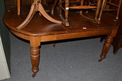 Lot 1191 - An oak dining table with turned and reeded legs, 190cm by 120cm by 72cm high