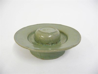 Lot 172 - A Korean Celadon Cup Stand, probably Koryo Dynasty, with central raised leaf moulded boss on a...