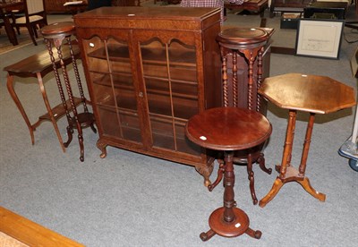 Lot 1219 - A burr walnut glazed bookcase 90cm by 30cm by 110cm together with a pair of mahogany torcheres, and