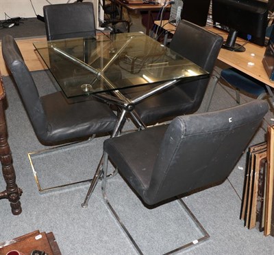 Lot 1225 - A glass top chromed metal table with four cantilever style chairs