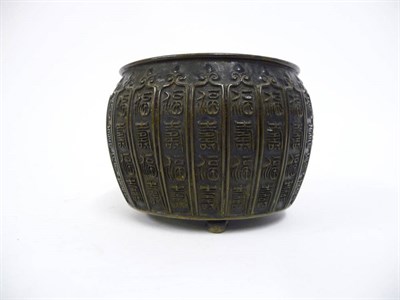 Lot 174 - A Chinese Bronze Small Censor, Qing Dynasty, of squat barrel form cast with ogee arched panels...