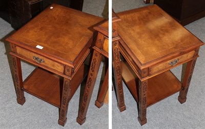 Lot 1233 - A pair of reproduction crossbanded burr walnut bedside tables, each fitted with a drawer and...