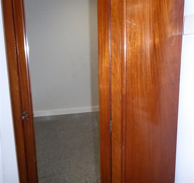Lot 1235 - A large mirrored corner wardrobe, approximately 125cm by 80cm by 205cm high