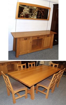 Lot 1236 - A Treske Furniture solid oak dining room suite comprising; a sideboard, the rectangular top above a