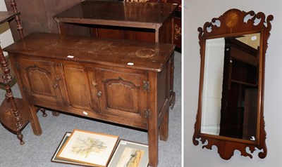 Lot 1240 - A reproduction panelled oak television cabinet, a small oak side table, a Georgian style fret...