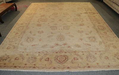 Lot 1248 - A Ziegler design carpet, the cream field with an all over design of palmettes and flower heads...