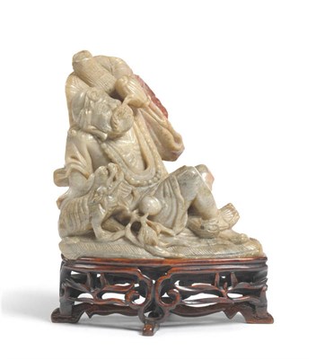 Lot 177 - A Chinese Carved Soapstone Figure of an Ascetic, Qing Dynasty, circa 1890, the emaciated figure...