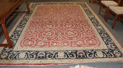 Lot 1262 - A good Pakistani carpet, the blood red field with an allover design of serrated leafy vines...